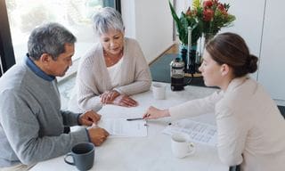 Couple discussing a life insurance loan with a representative